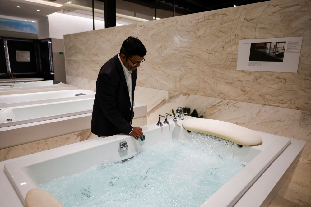 An employee displays a bathtub inside a Kohler experience centre in Mumbai October 17, 2024. — Reuters pic  