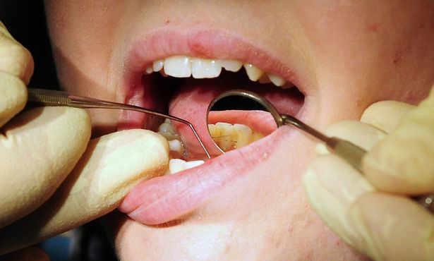  a dentist at work,