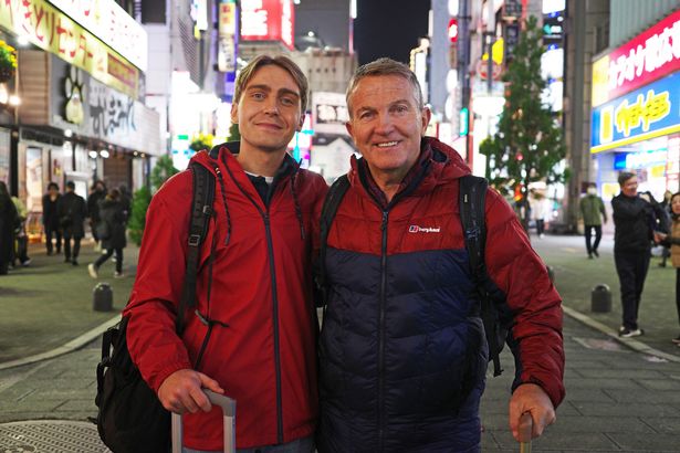 Photo of Barney Walsh and his dad Bradley in Japan. They are in a scene from their ITV show Breaking Dad