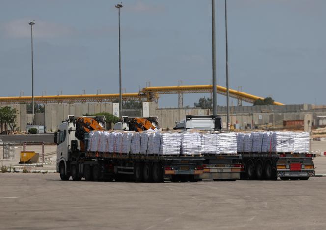 Trucks carrying aid, make their way to Gaza, at the Kerem Shalom crossing, on the Israeli side of the crossing, May 19, 2025.