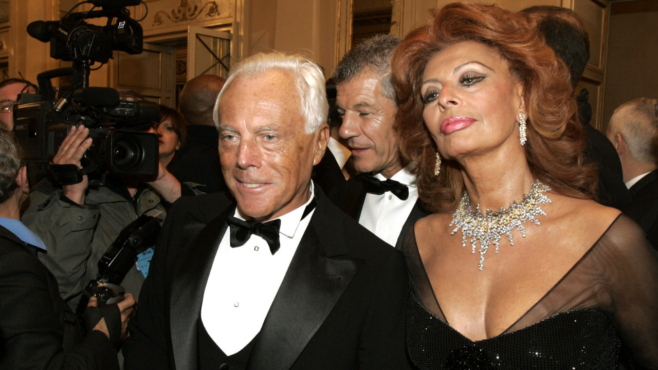 Italian actress Sophia Loren right and fashion designer Giorgio Armani arrive for the reopening of La Scala theater in Milan Dec 7 2004 Credits AP