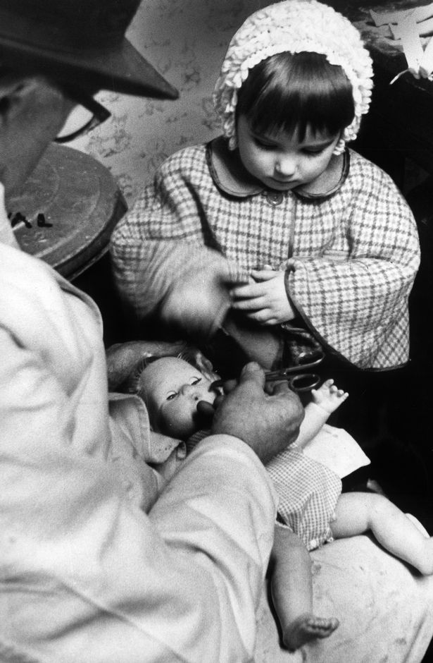 John Clifford Higgins, known as Doc Higgins, at work at the Original Dolls Hospital, Piccadilly, Manchester. 17th January 1969