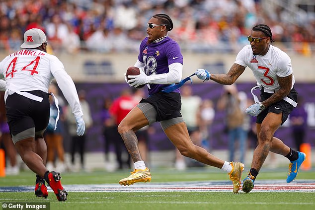 Justin Jefferson of the Vikings has his flag pulled by Derwin James Jr. of the Chargers