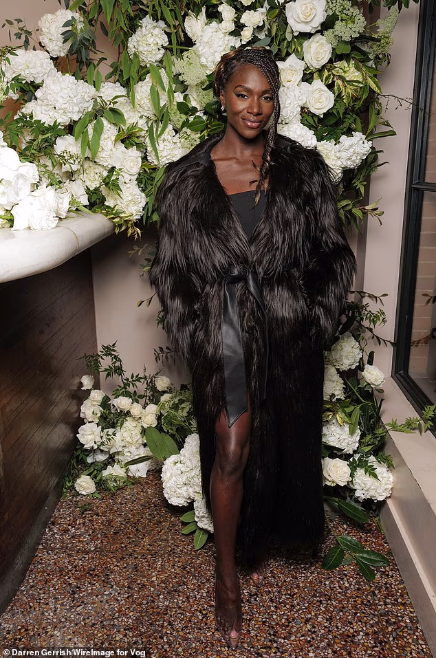 Elsewhere British runner Dina Asher-Smith wore a dramatic M&S x 16Arlington black fur wrap trench coat (£295) and an M&S x 16Arlington strapless mini-dress (£100)