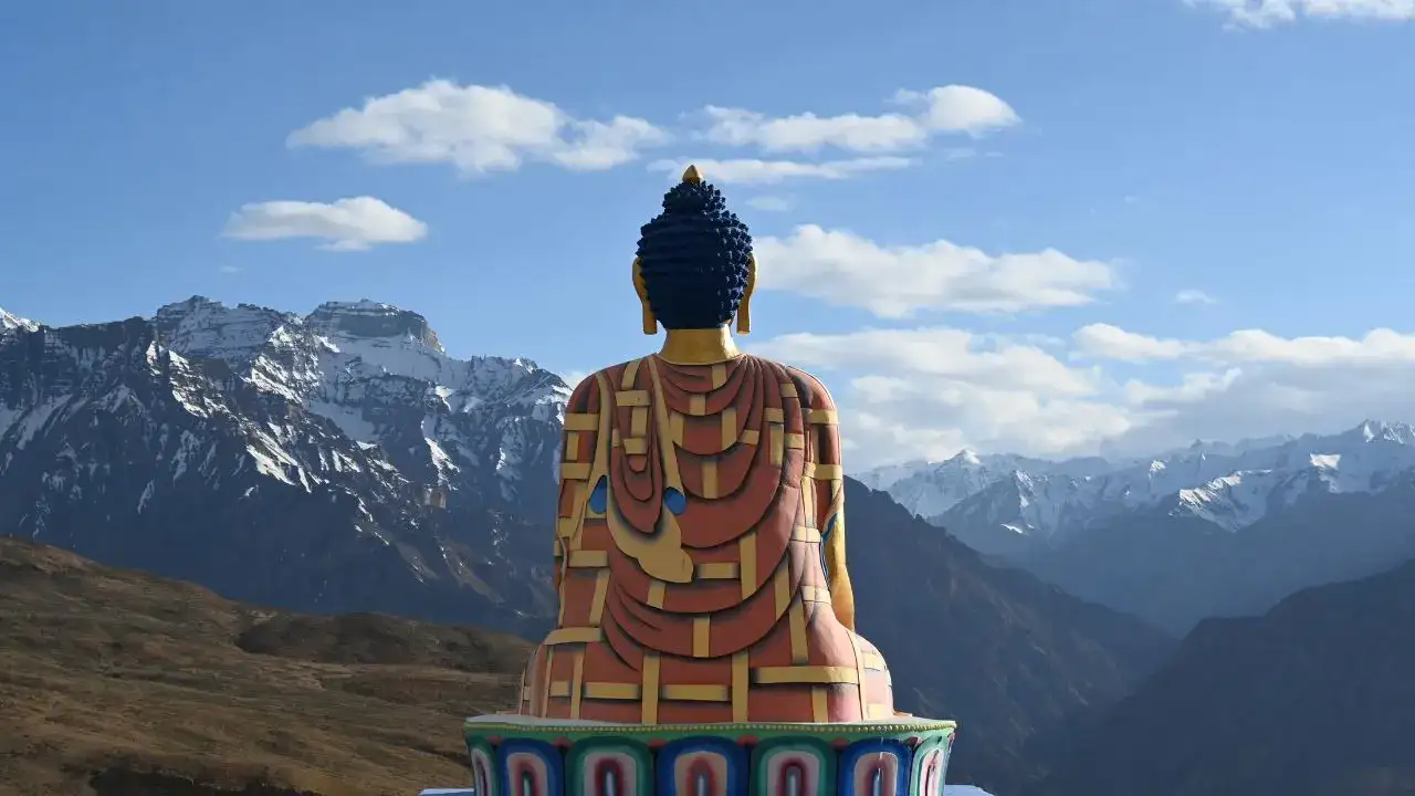 Langza village is watched over by a towering Buddha statue said to protect its people and travellers alike Langza village is watched over by a towering Buddha statue said to protect its people and travellers alike