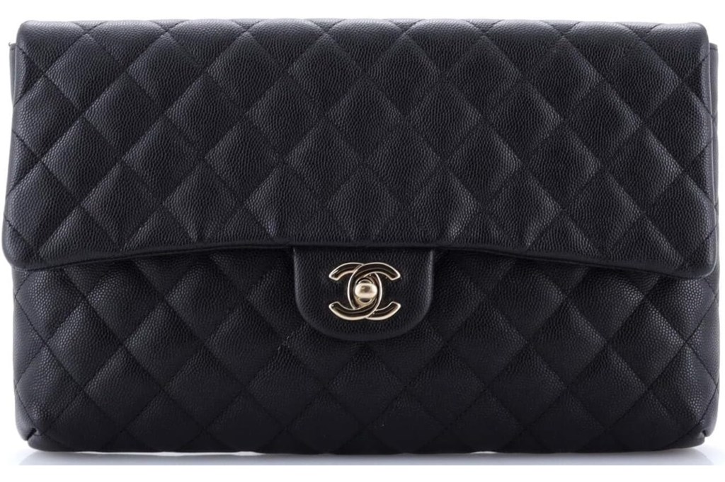 Black quilted Chanel handbag with gold CC logo clasp.