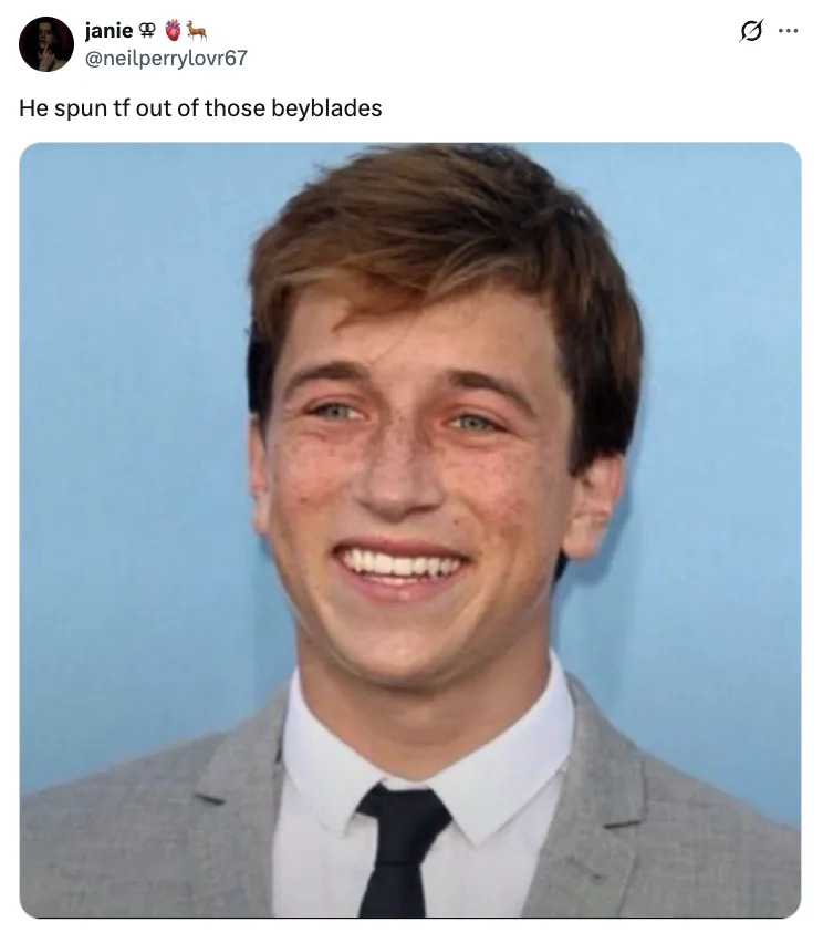 Skyler Gisondo smiling in a suit and tie against a plain background; tweet reads: "He spun tf out of those beyblades."