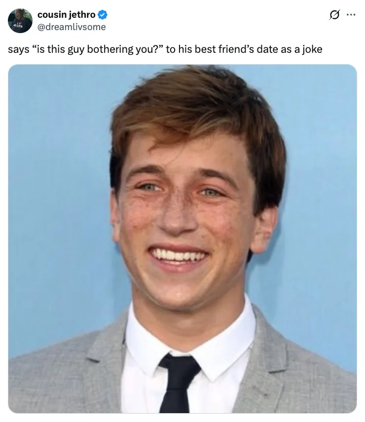 Skyler Gisondo smiling in a light suit and thin tie, with text about a joke: "says 'is this guy bothering you?' to his best friend's date as a joke."