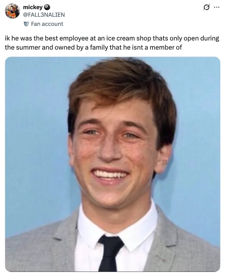 Skyler Gisondo smiling against a plain backdrop, tweet humorously suggesting he looks like an ice cream shop employee at a shop owned by a family he isn't a part of