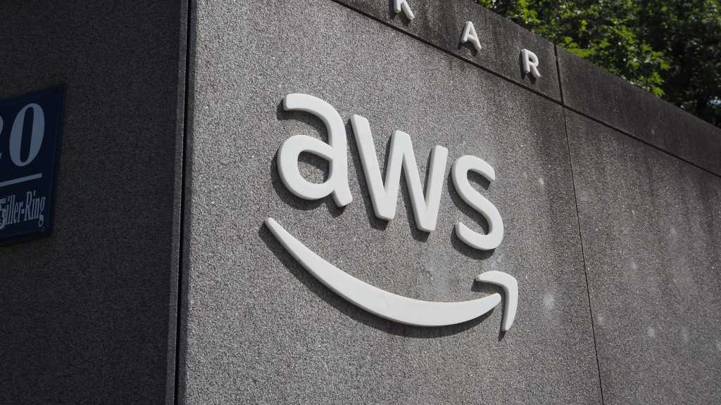 AWS’s repeated problems with AI agent controls illustrates the autonomous agent dilemma AWS logo on wall