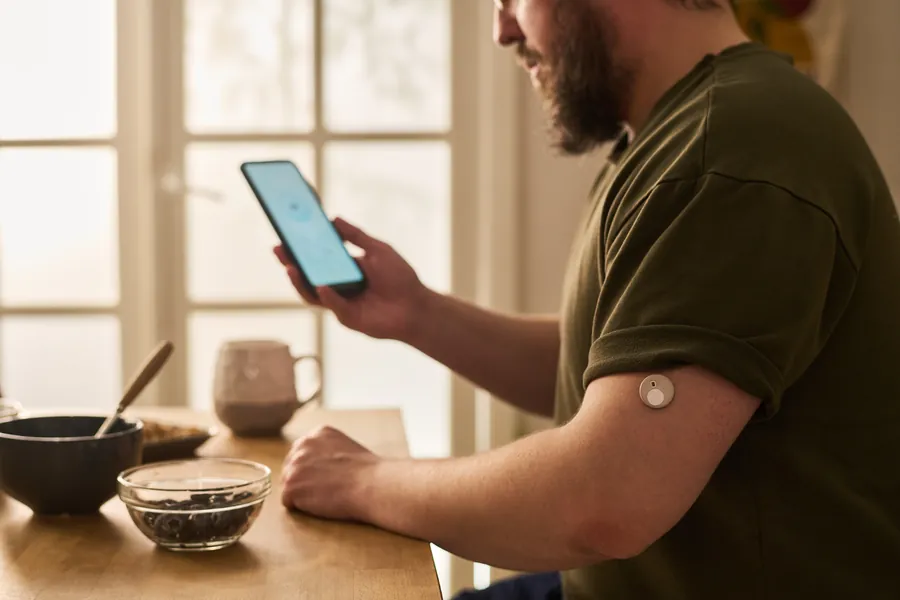 Man checking blood glucose levels