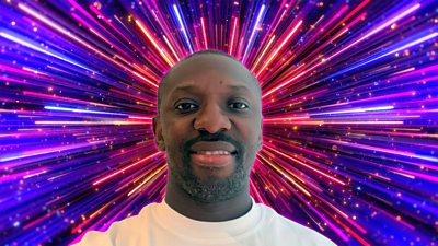 Headshot of Shaun Wright-Phillips in front of branding for Strictly Come Dancing 2026 - a background of glittering pink, purple and gold beams of light.