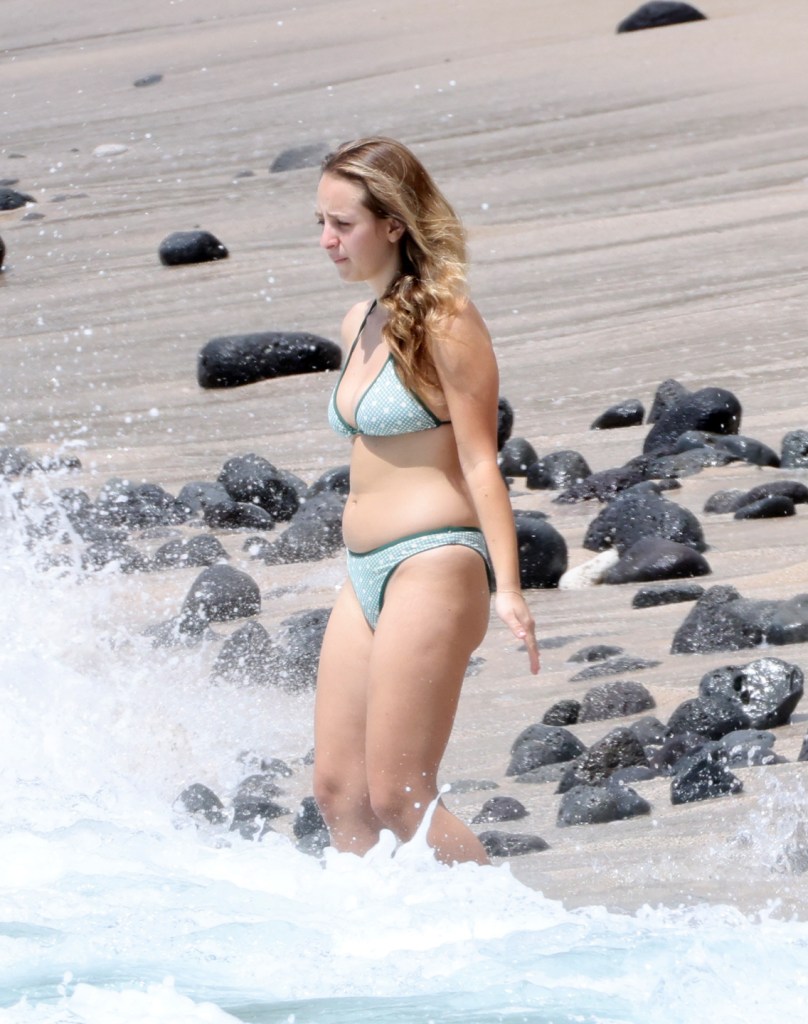 Ruby Sweetheart Maguire wears a green bikini while swimming at a beach in Hawaii.