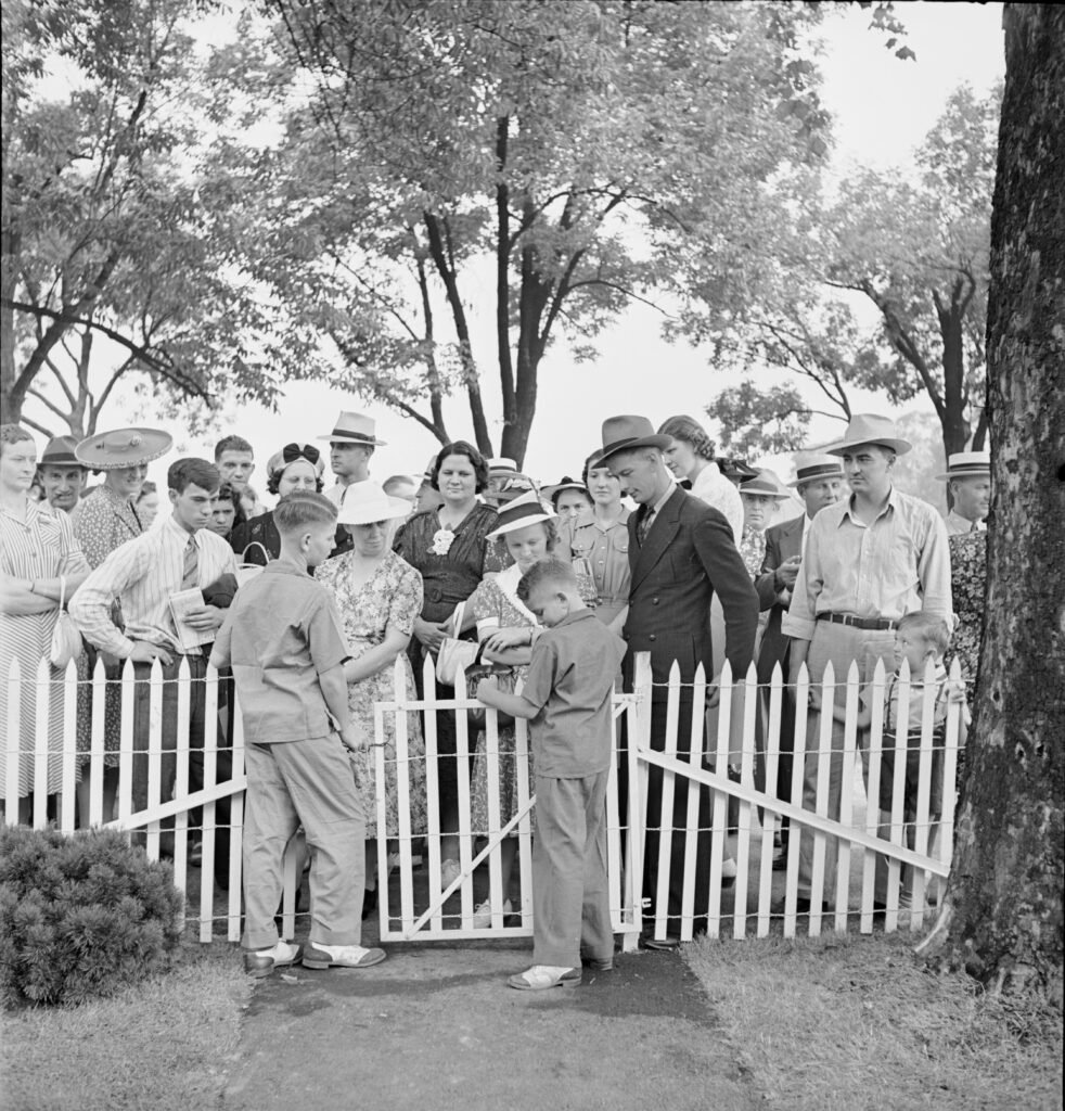 Visitors to the Ohio state fair talked with Dean and Wayne Engel, two of the children in "Ohio's Most Typical Farm Family," on display at the Ohio state fair,1941.