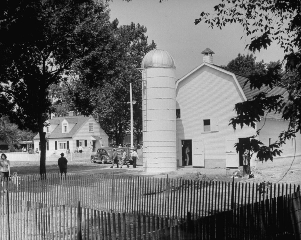 The Engels family, chosen as Ohio's most typical farm family, lived in this makeshift version of their farm while on display for a week at the Ohio state fairgrounds, 1941.