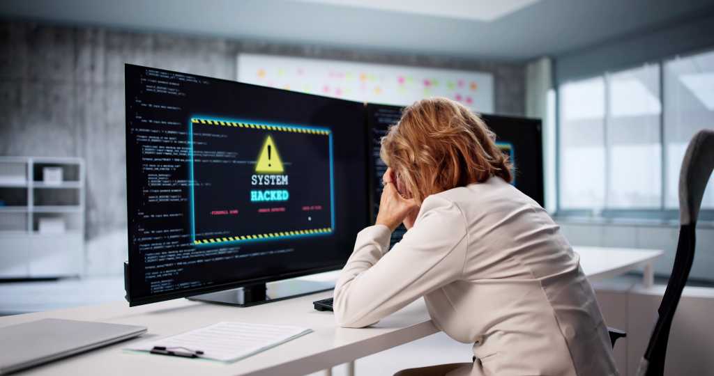 Ransomware extortion gets personal as attackers target employees’ families Senior Analyst Woman Worries About Cyber Ransomware Attack On Business PC.