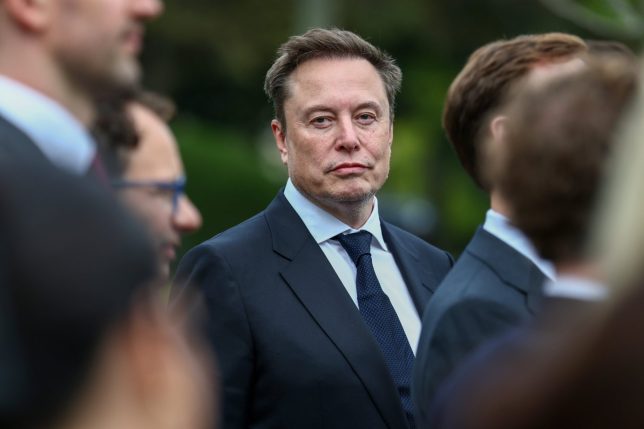 WASHINGTON, DC - SEPTEMBER 29: Tesla, SpaceX and X CEO Elon Musk attends a press briefing held by U.S. President Donald Trump with AI executives following a meeting on artificial intelligence, outside the West Wing of the White House on September 29, 2026 in Washington, DC. The meeting comes as some have called for a slowdown in AI development amid rising safety concerns. (Photo by Finn Gomez/Getty Images)