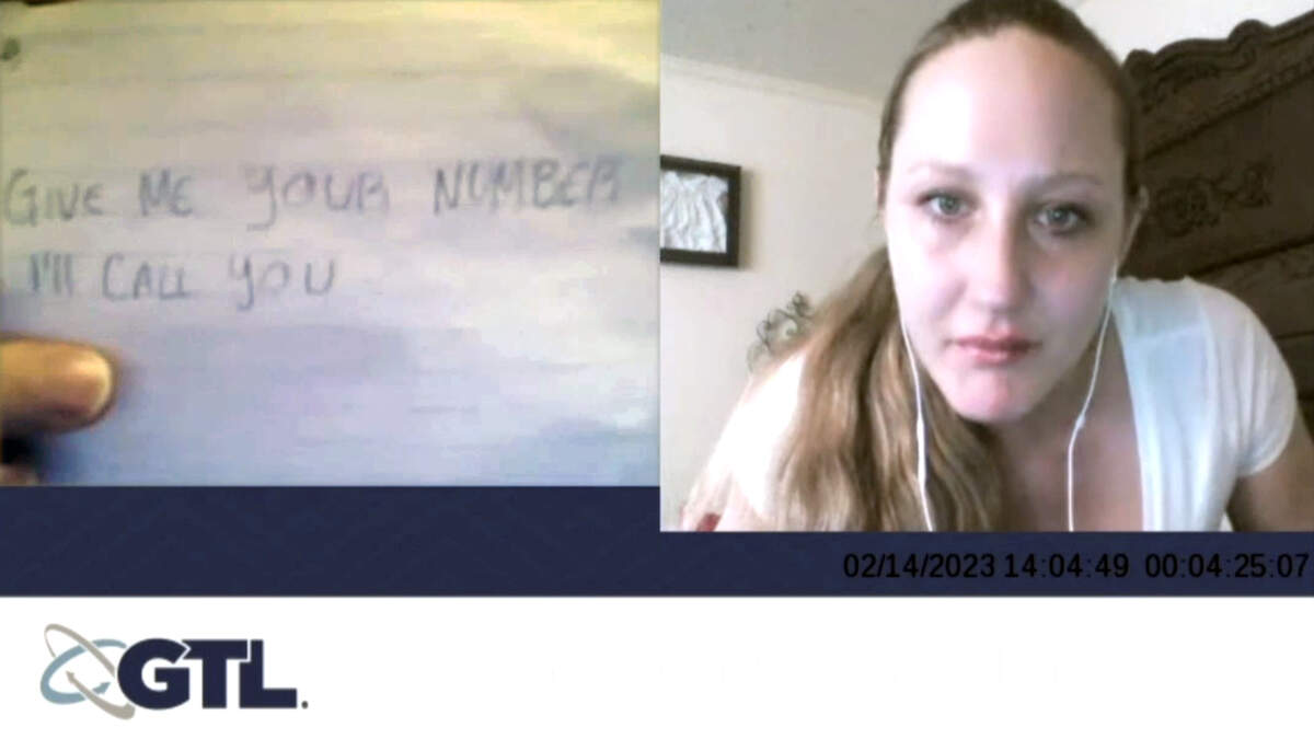 Screenshot 2026-10-19 at 11.04.32 AM.jpg Video of a jail phone call between defendant Miguel Salguero Olivares and Katie Ellen (right) shows a note held up by Salguero Olivares, which provided a handwriting sample to compare to writing found on a fast food bag in the bedroom of Faith Hedgepeth.