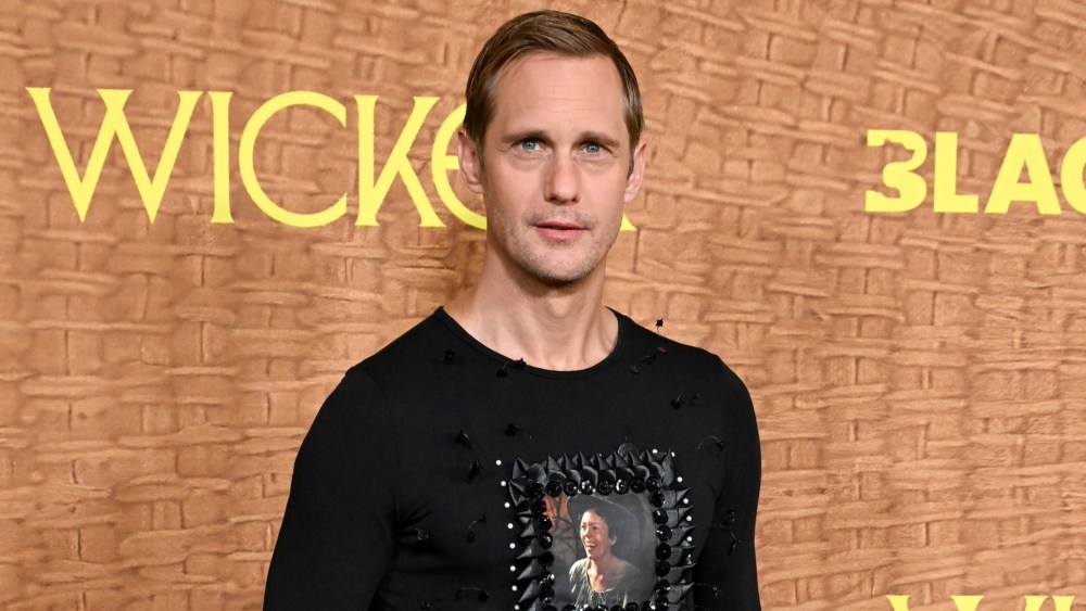 Alexander Skarsgard Wears Olivia Colman’s Face and A Plaid Skirt in LA Alexander Skarsgard wears custom Chopova Lowena at the "Wicker" premiere on Oct. 20 in Los Angeles.