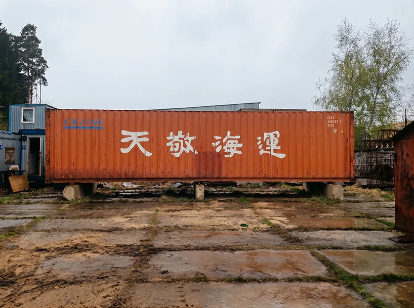 Innovative Birch Plywood Interior Transforms Shipping Container into Modern Micro-Cabin Original shipping container before transformation into micro-cabin.