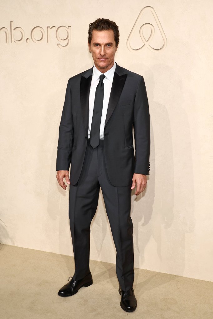 Matthew McConaughey in a dark suit at the Airbnb.org Gala.