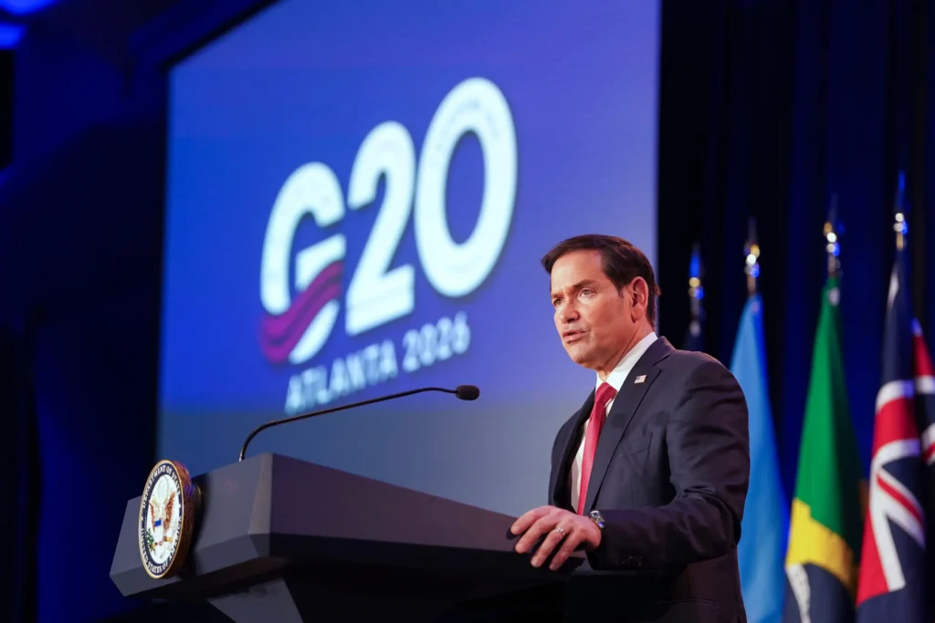 No Group Photo: Rubio Calls Off Family Photo at G20 FMs Meeting Over Russia Row Marco Rubio speaks at a podium in front of a screen displaying the G20 Atlanta 2026 logo