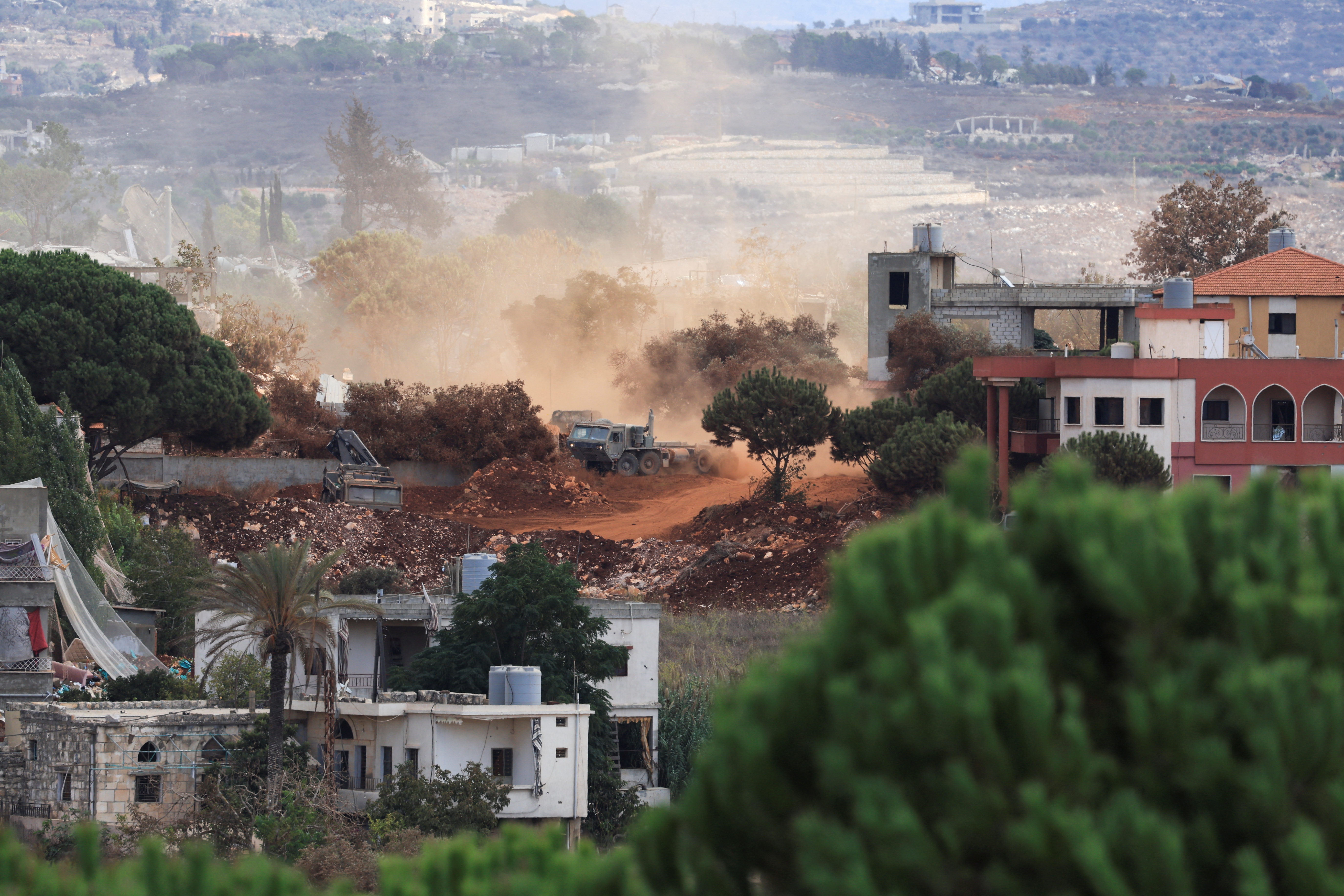 An Israeli army vehicle operates in East Zawtar, as seen from West Zawtar, southern Lebanon, October 1, 2026. (Reuters)