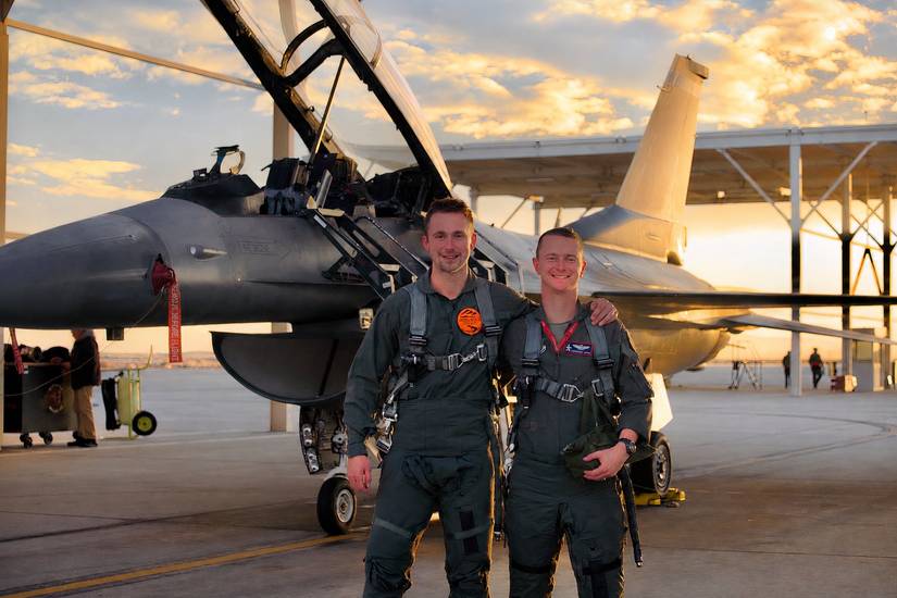 A photo showing Louis Skupien with USAF F-16 pilot Anthony Pipe (Maj USAF).