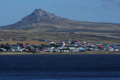 Mount Tumbledown stands tall behind Stanley on the Falkland Islands, also known as Islas Malvinas, March. Credit: Ricardo Mazalan/AP Mount Tumbledown stands tall behind Stanley on the Falkland Islands, also known as Islas Malvinas, March.